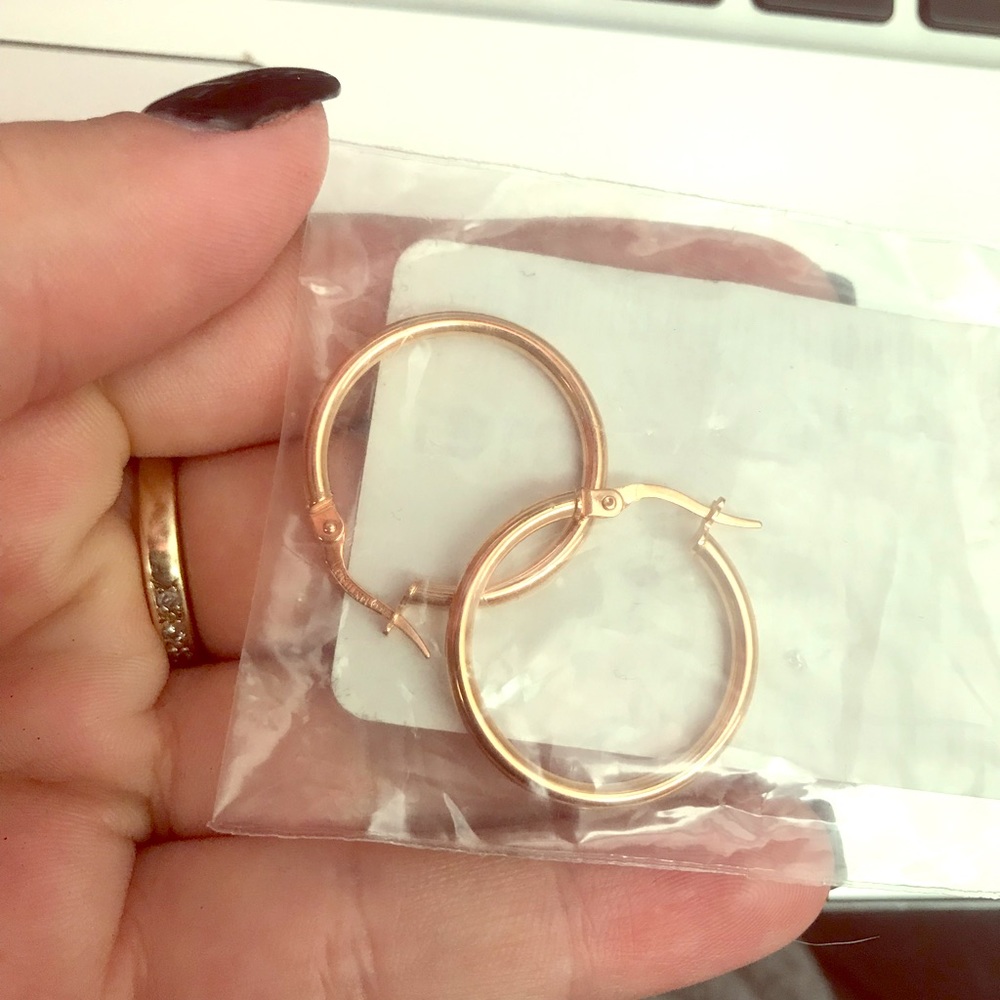 14K rose gold Italian-made hoops.